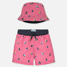 Load image into Gallery viewer, Mayoral Singapore Swimwear. Little boys swimming trunks and reversible sun hat by Mayoral, with red and white stripes and sailing boat print. Made from soft polyester, the trunks have a comfortable mesh lining, and the reversible hat has a navy blue side.

